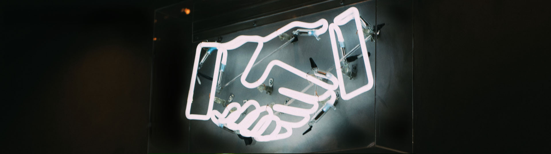 Neon Light of Handshake - Representing Friendly Legal Agreement